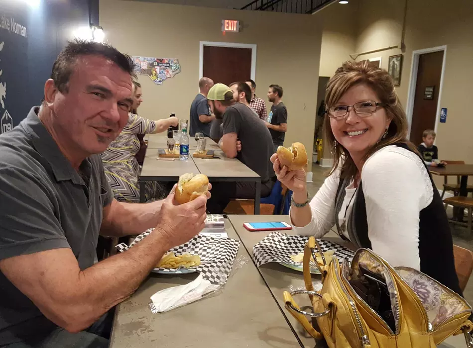 Lovely couple enjoying Chicken Sausage at D9 Brewing Company.