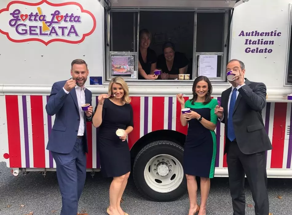 Four business people enjoying gelato in front of the Gotta Lotta Gelato food truck