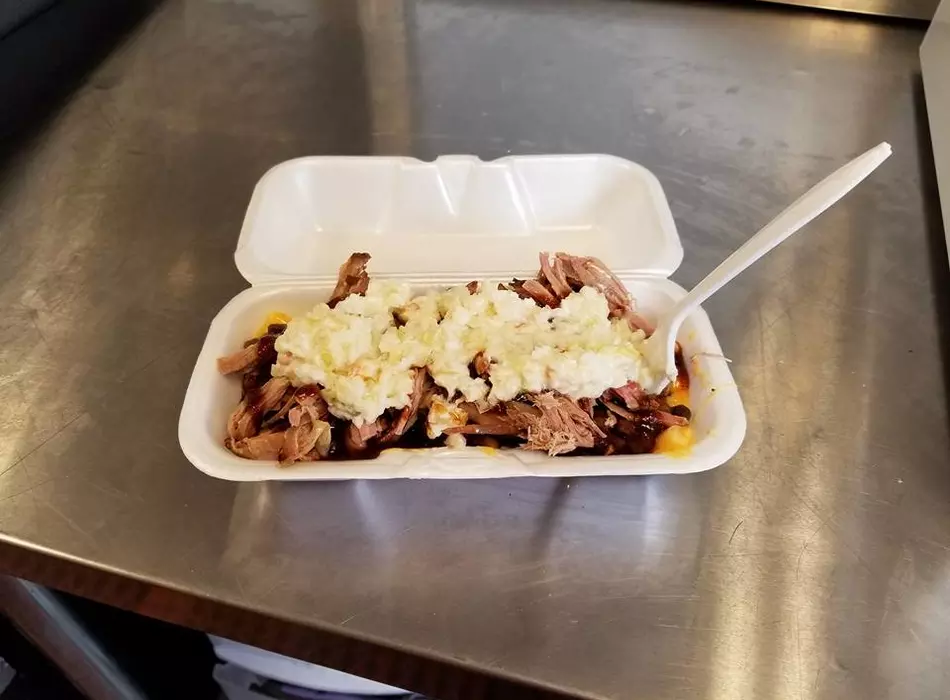 The "Pit" our most popular menu item. It's a layered bowl of smoked mac&cheese, baked "pit" beans and your choice of meat with cole slaw on the side. The best of everything in a bowl!