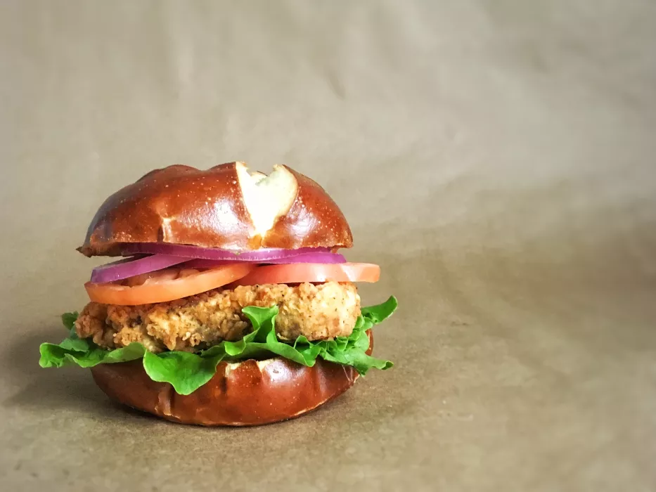 Bartleby's deluxe sandwich on brown paper background.