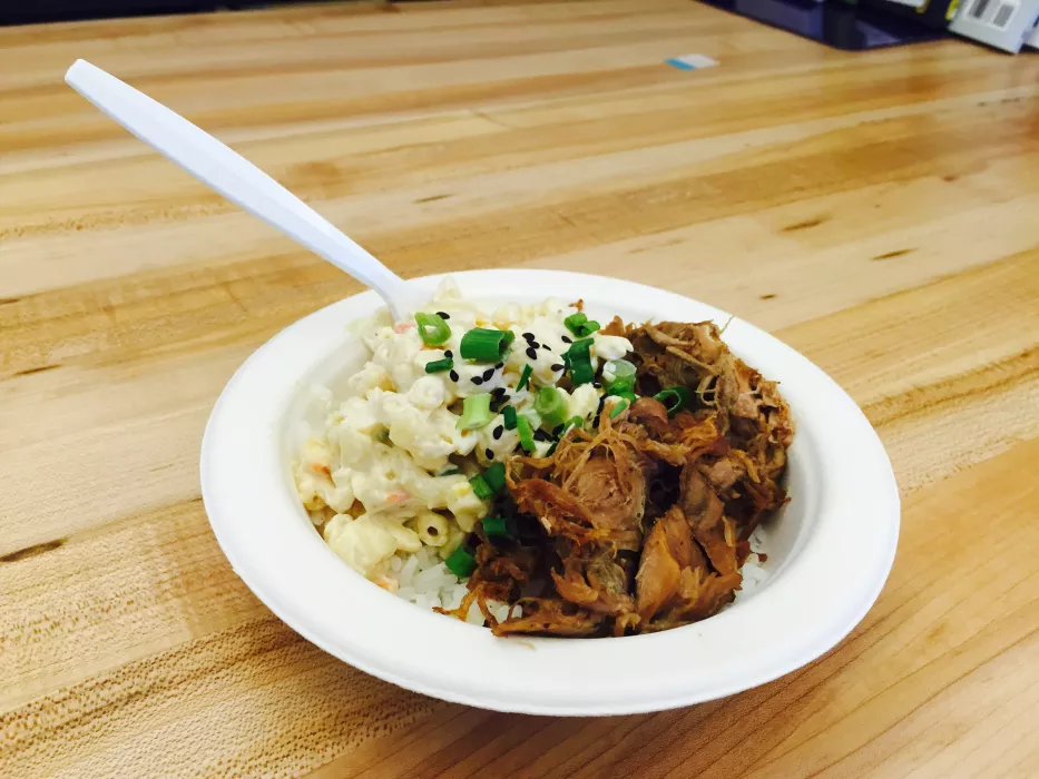 Kalua Pig rice bowl piled high with creamy Macaroni Salad.