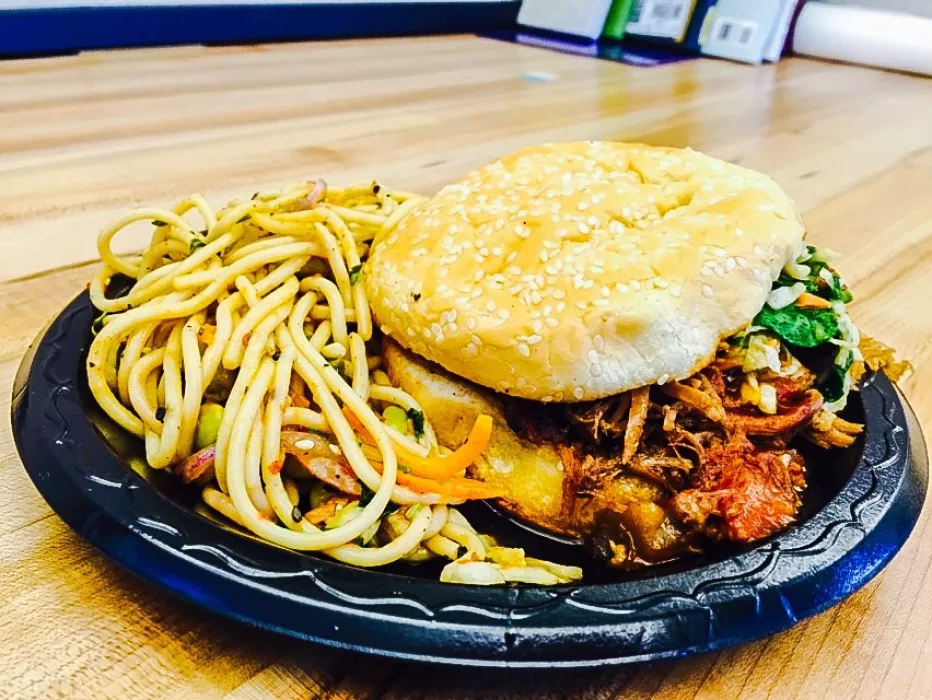 Kalua Pig sandwich with a side of Edamame Pasta Salad.